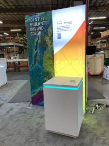 RENTAL: (1) 5 ft. Wide x 12 ft. High Double-Sided Lightbox, (2) 5 ft. Wide x 8 ft. High Double Framed Kiosks with One Backlit and One Non-Backlit, (4) RE-1575 White Laminated Counters with Recessed LED/RGB Lighting, (1) RE-1576 White Laminted Counter with