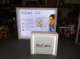 VK-1340 Custom Lightbox with SEG Fabric Graphics, Monitor Mount, and MOD-1563 Backlit Counter with Locking Storage